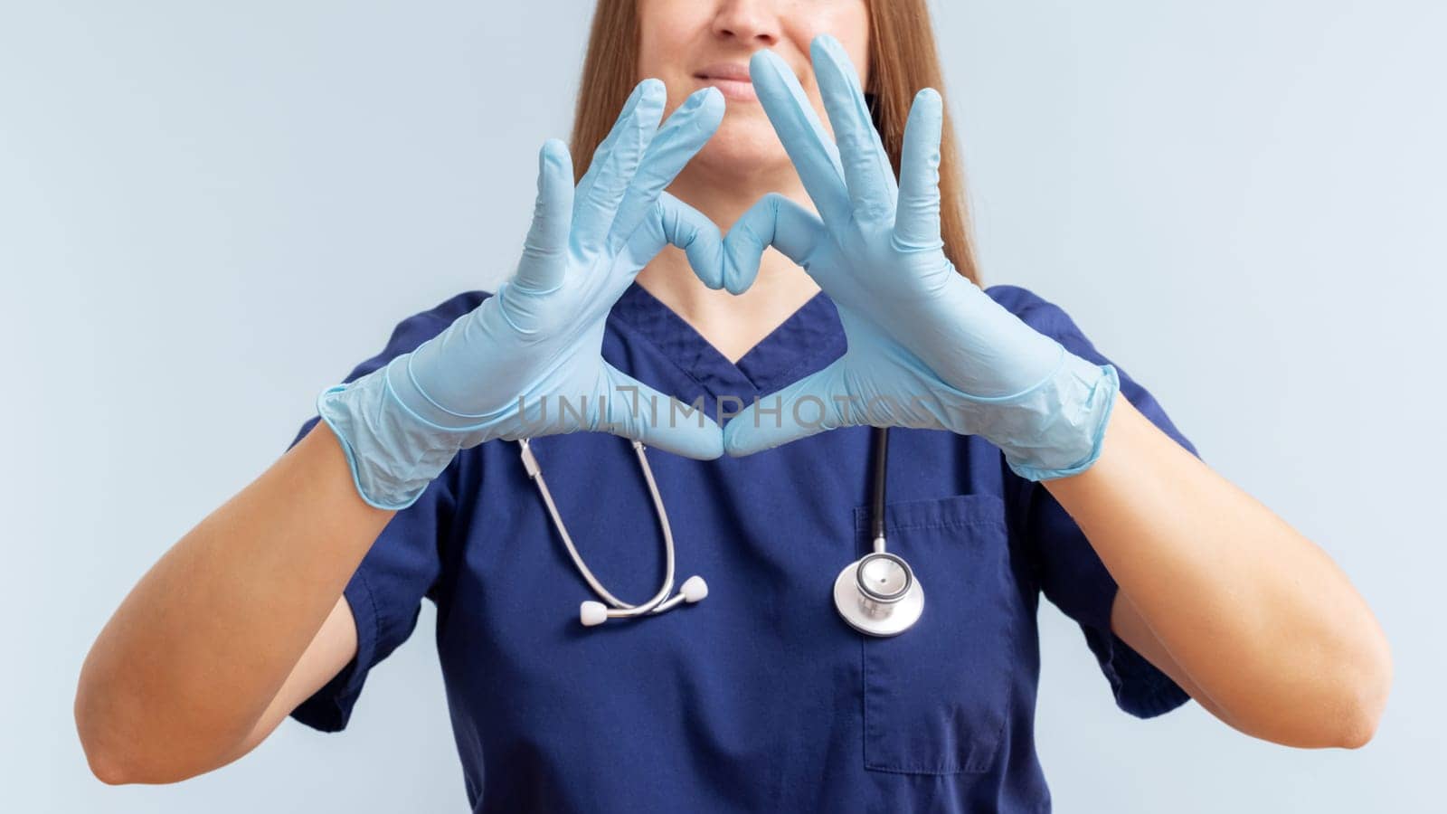 Nurse Making Heart Sign with Hands by andreyz