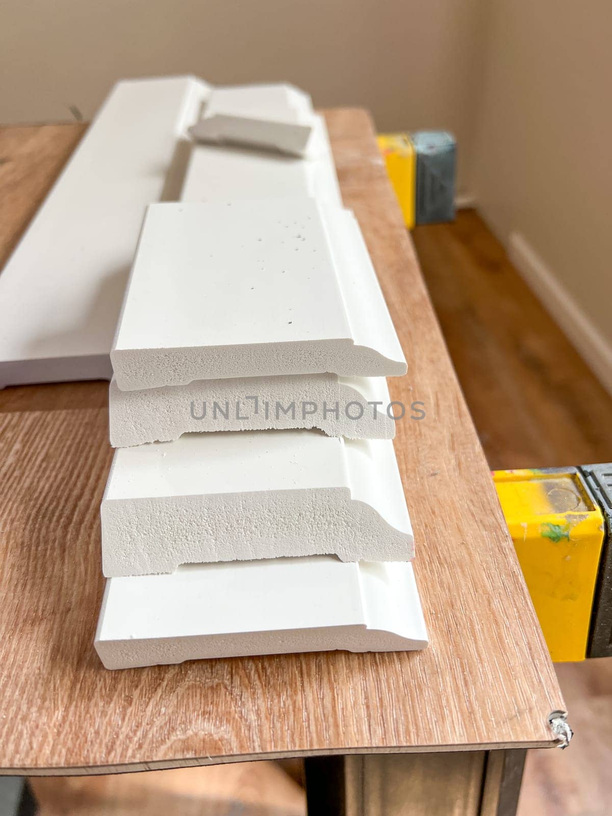 Installing Vinyl Baseboards in a Modern Home Renovation Project by arinahabich