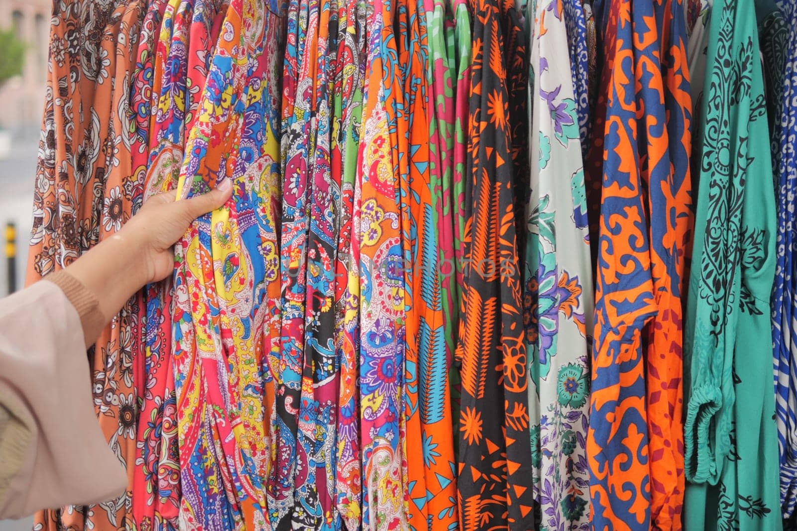 woman choosing clothes in shop