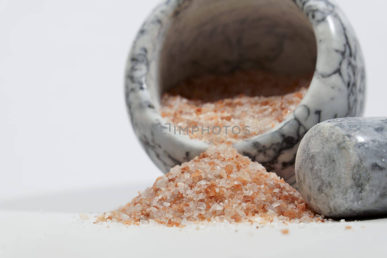 himalayan pink salt in a ceramic mortar by joseantona