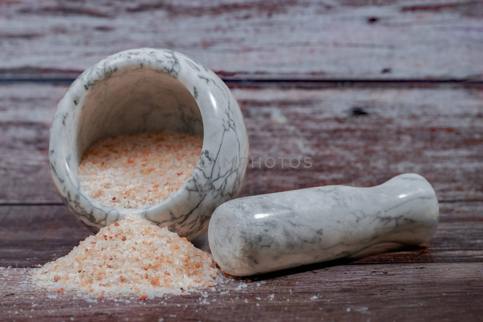 himalayan pink salt in a ceramic mortar by joseantona