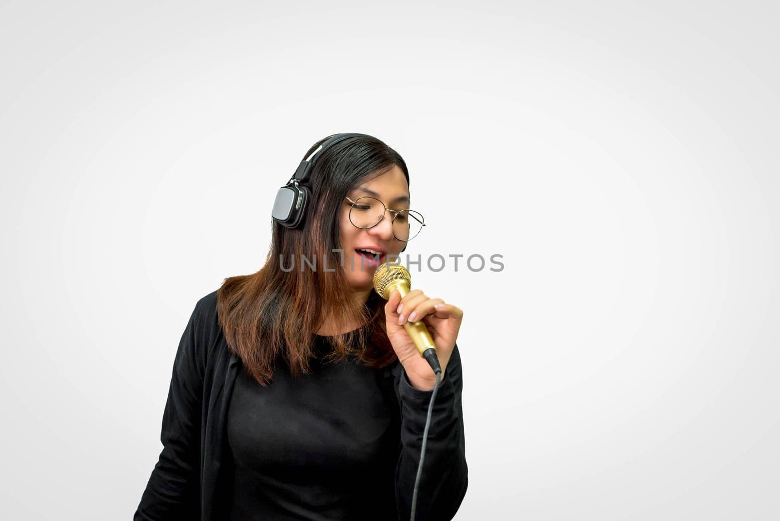 Woman (LGBTQ) singer sing a song with microphone by NongEngEng