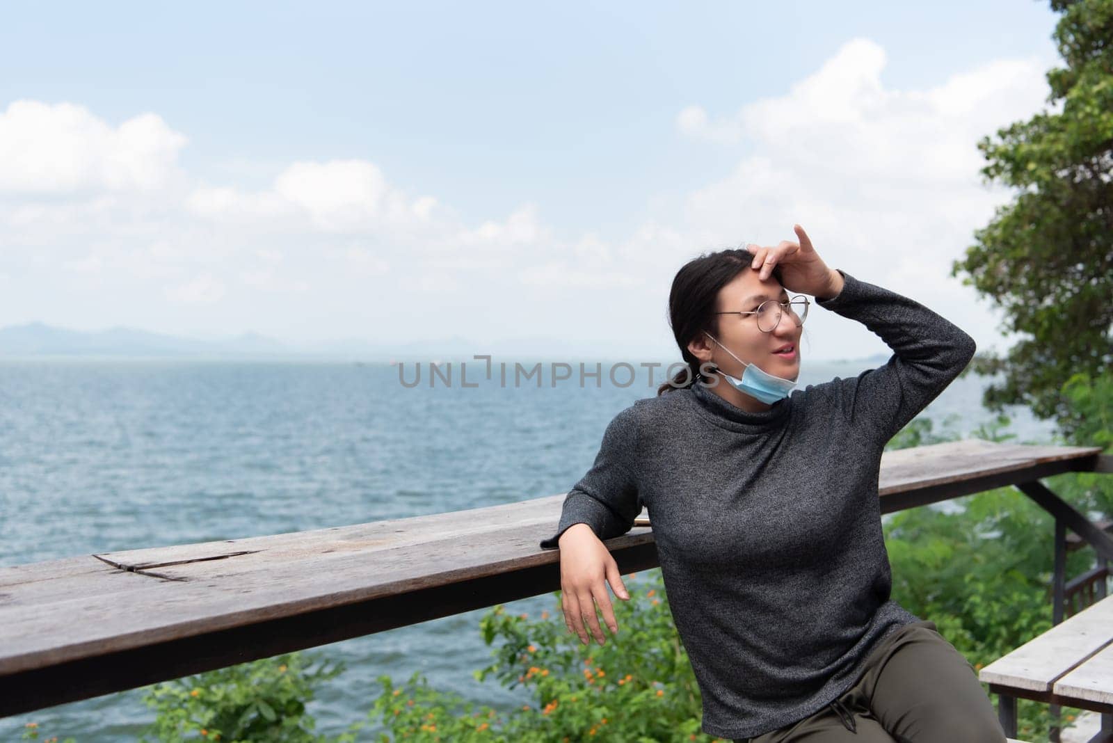 Woman (LGBTQ) posing at sea viewpoint with happy by NongEngEng