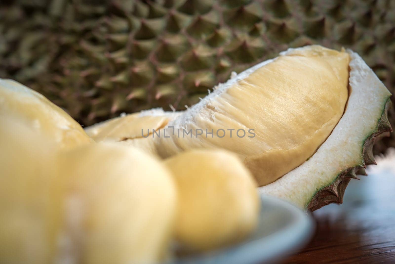 Durian is a king of fruit in Thailand and asia fruit have a spikes shell and sweet can buy at Thai street food and fruit market at agriculture farm