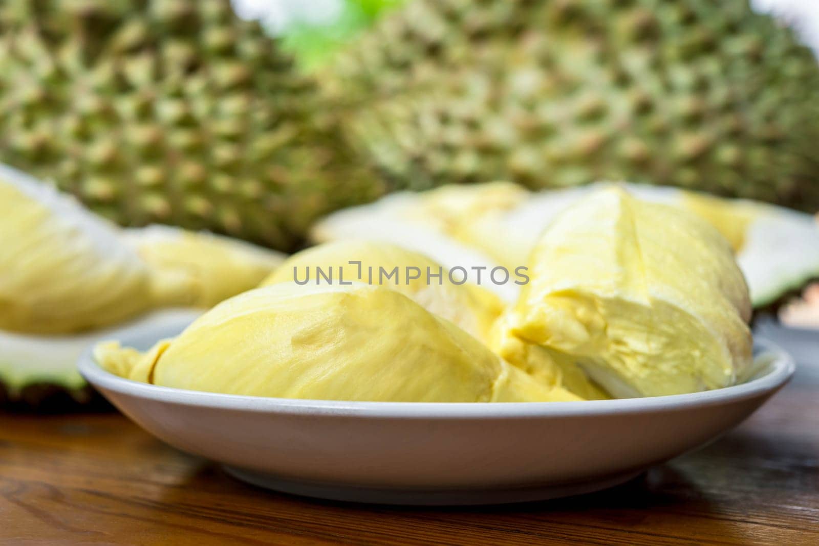 Durian is a king of fruit in Thailand and asia fruit have a spikes shell and sweet can buy at Thai street food and fruit market at agriculture farm