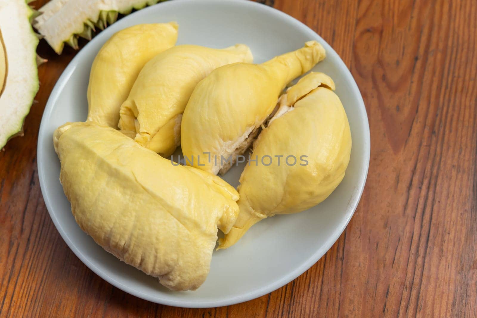 Durian is a king of fruit in Thailand and asia fruit have a spikes shell and sweet can buy at Thai street food and fruit market at agriculture farm