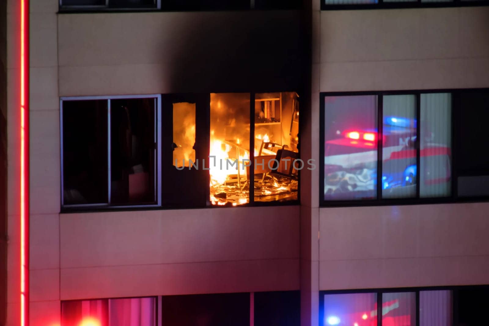 close-up of a raging fire in an apartment building by Annado