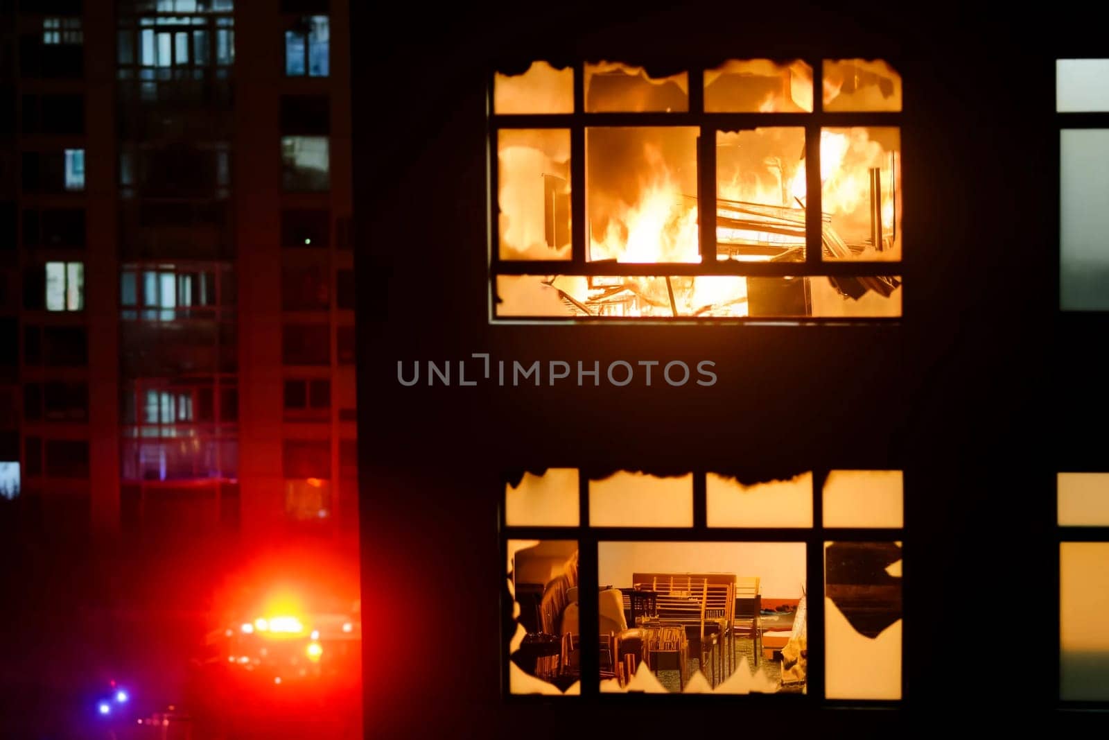 close-up of a raging fire in an apartment building by Annado