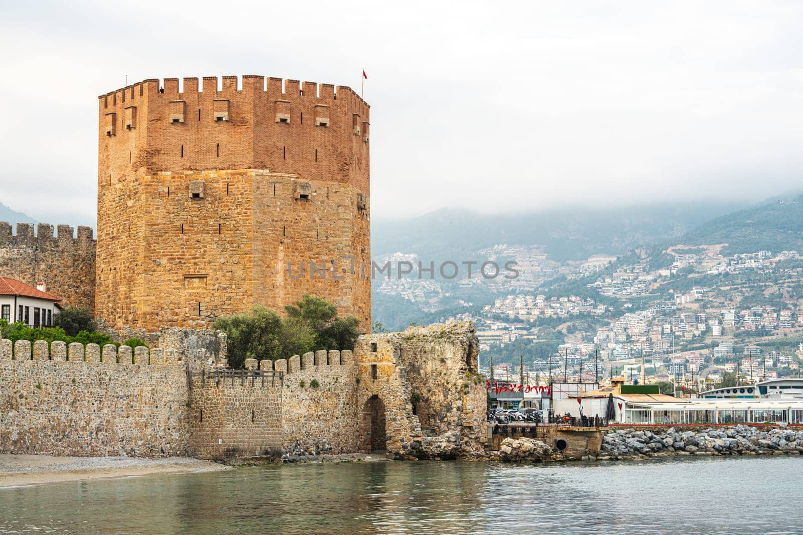 The historical Red Tower in the Alanya district of Antalya, one of the touristic regions of Turkey. Turkish name Kizil Kule