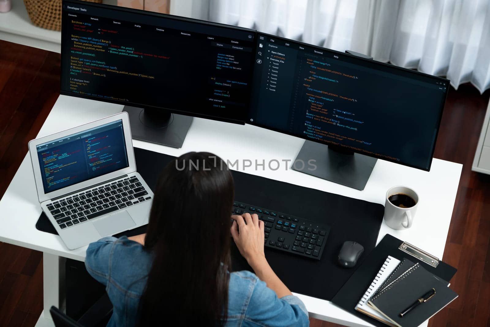 Top view young Asian IT developer creating with typing online information on pc with coding program data of website application, wearing jeans shirt. surround by safety analysis two screen. Stratagem.