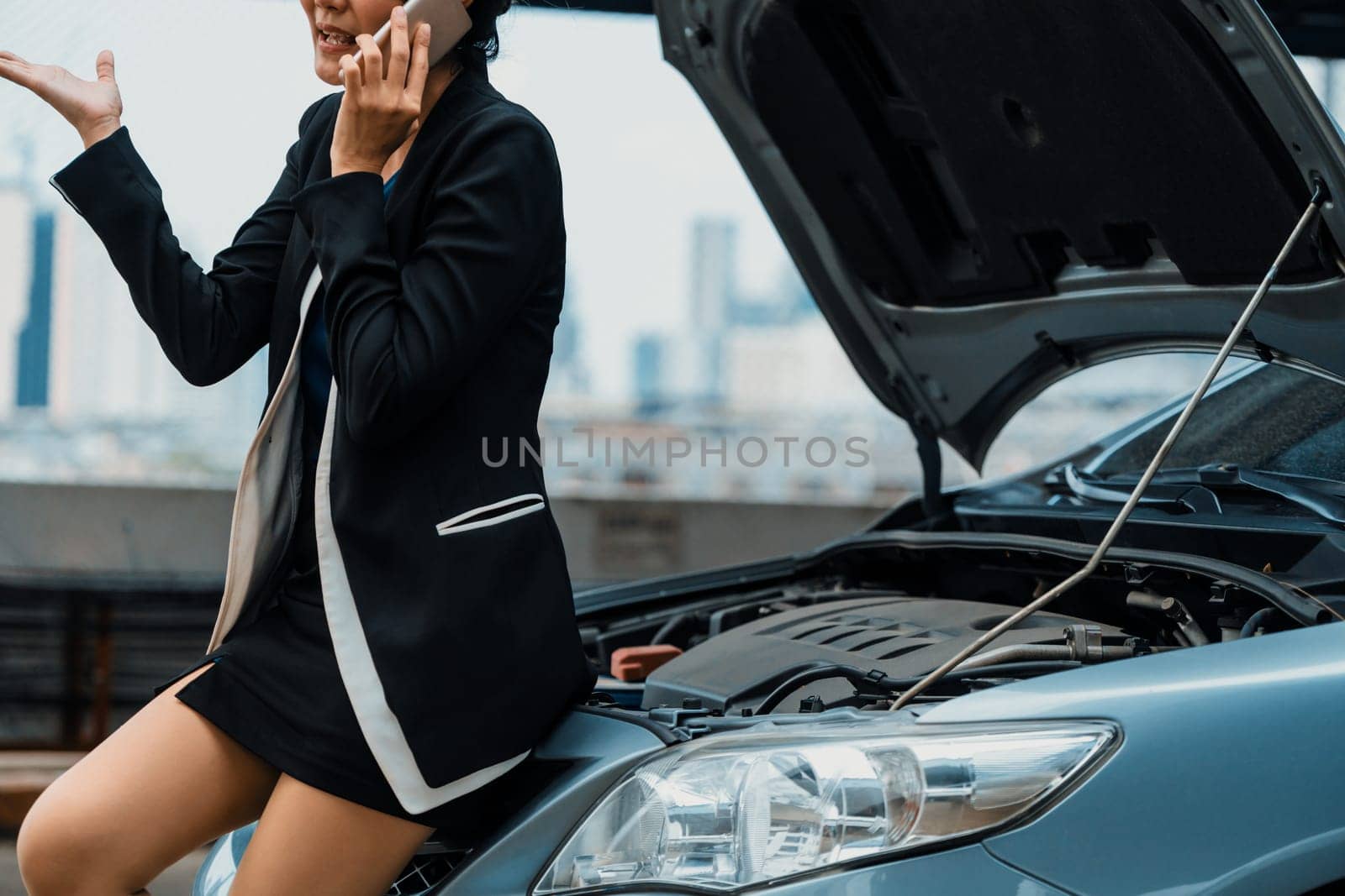 Woman whose car breakdown call for repair service. uds by biancoblue