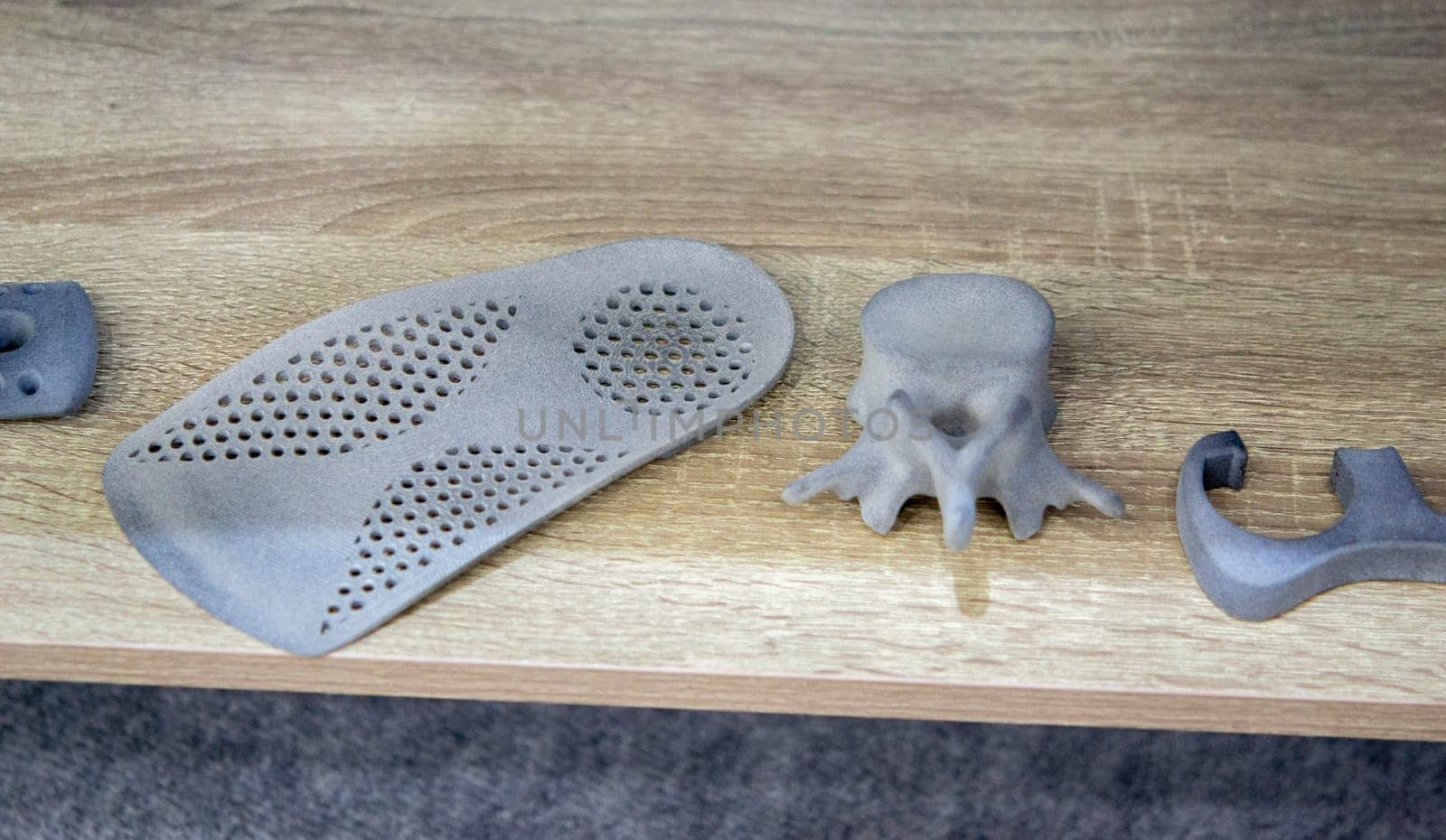 Shoe pad and Prototype model of human vertebra 3D printed from polyamide powder. Technology Multi Jet Fusion MJF. Three-dimensional model printed on 3D printer from plastic. Additive powder technology