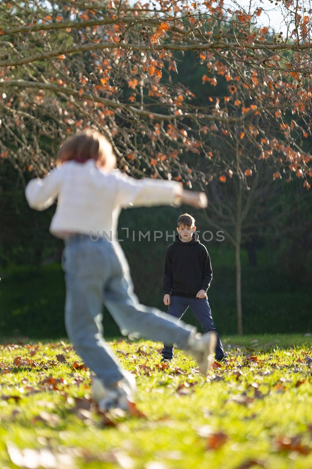 Two children playing in a park by Studia72