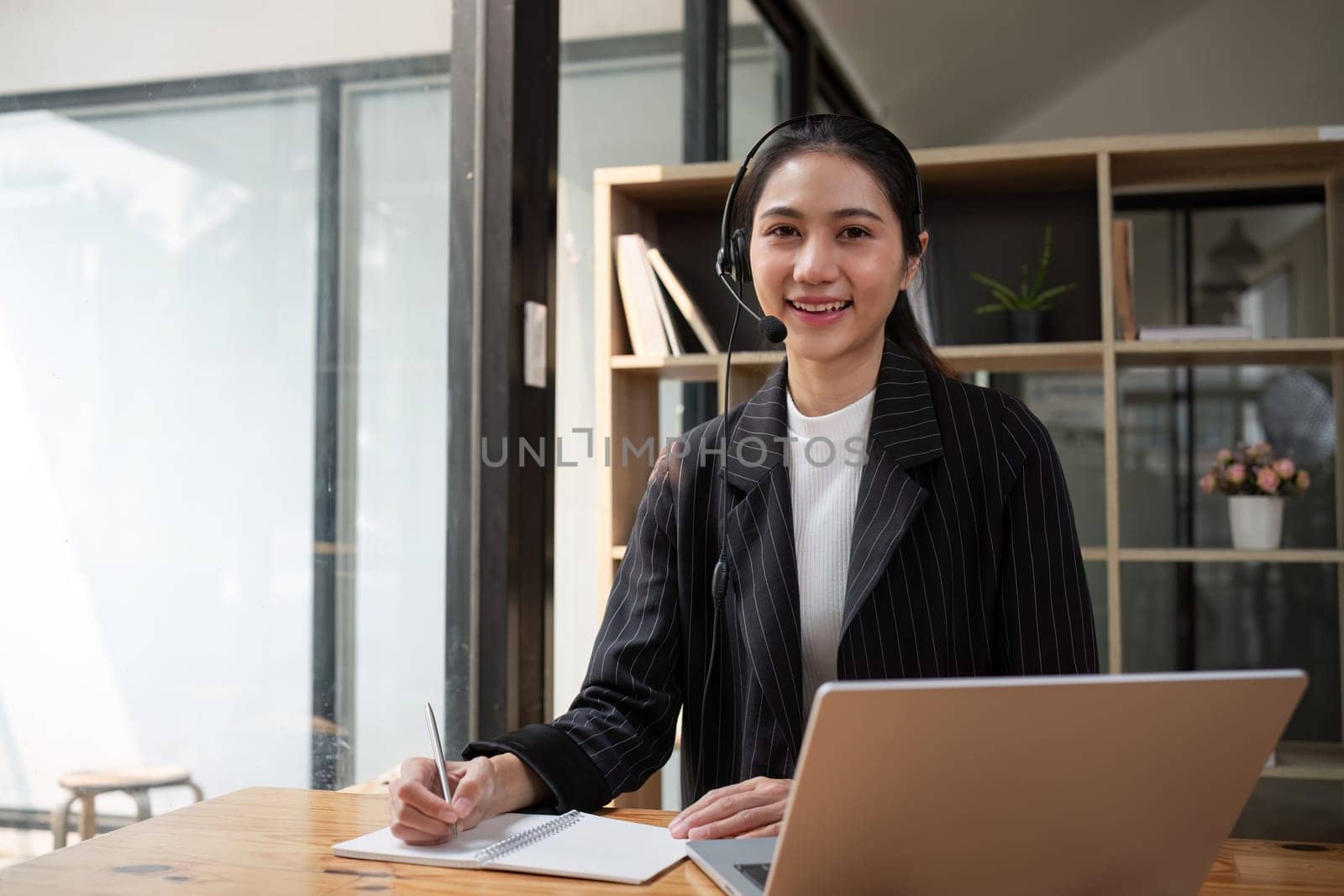 Call center friendly woman asian in office for customer service, technical support and advice, contact and communication with employee operator in help desk agency.