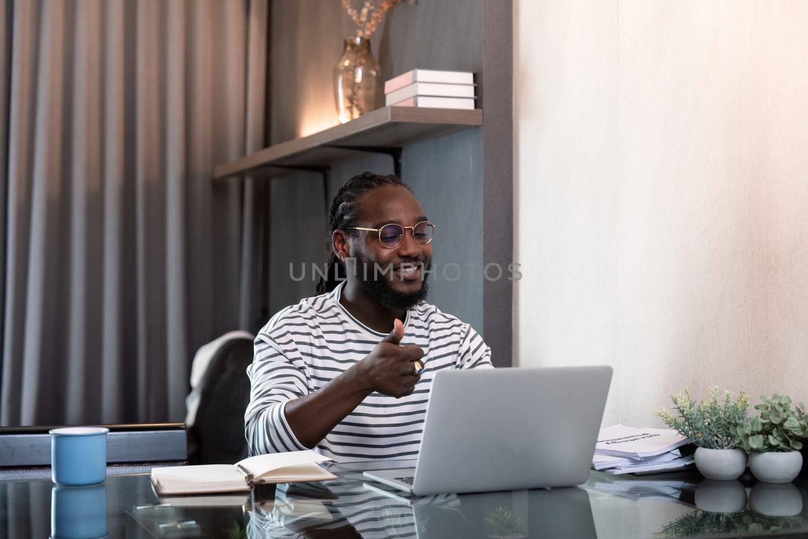 African american business afro man live online meeting on computer home. Freelance online sme marketing, young happy man video call meeting on laptop alone at home.