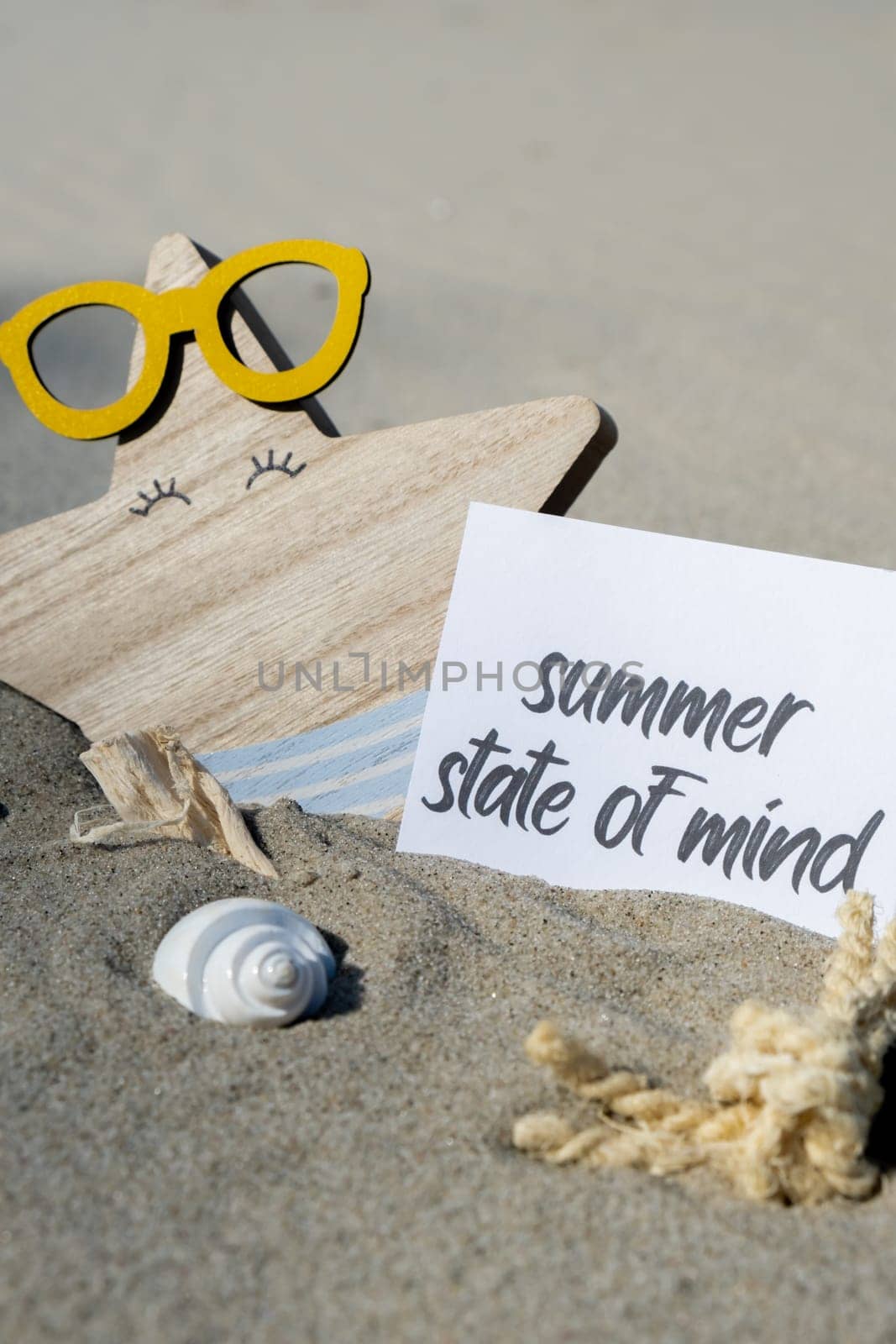 SUMMER STATE OF MIND text on paper greeting card on background of funny starfish in glasses summer vacation decor. Sandy beach sun coast. Holiday concept postcard. Getting away Travel Business concept