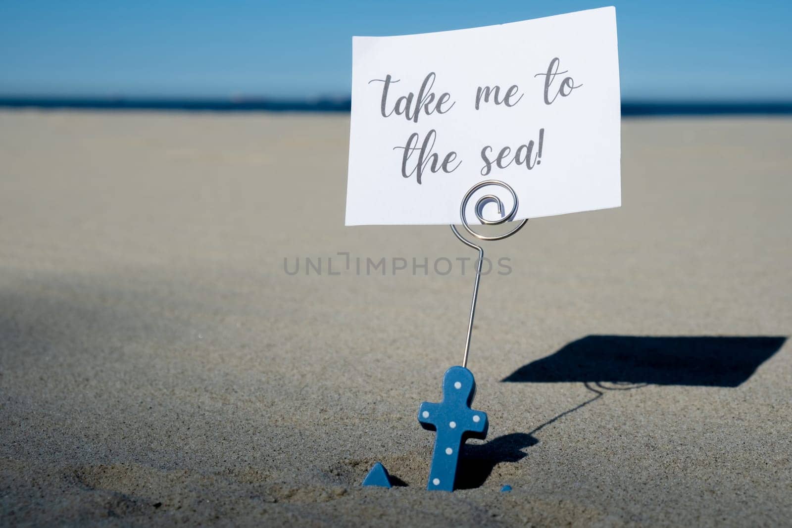 TAKE ME TO THE SEA text on paper greeting card in anchor paper holder and starfish seashell summer vacation decor. Sandy beach sun coast. Holiday concept postcard. Getting away Travel by anna_stasiia