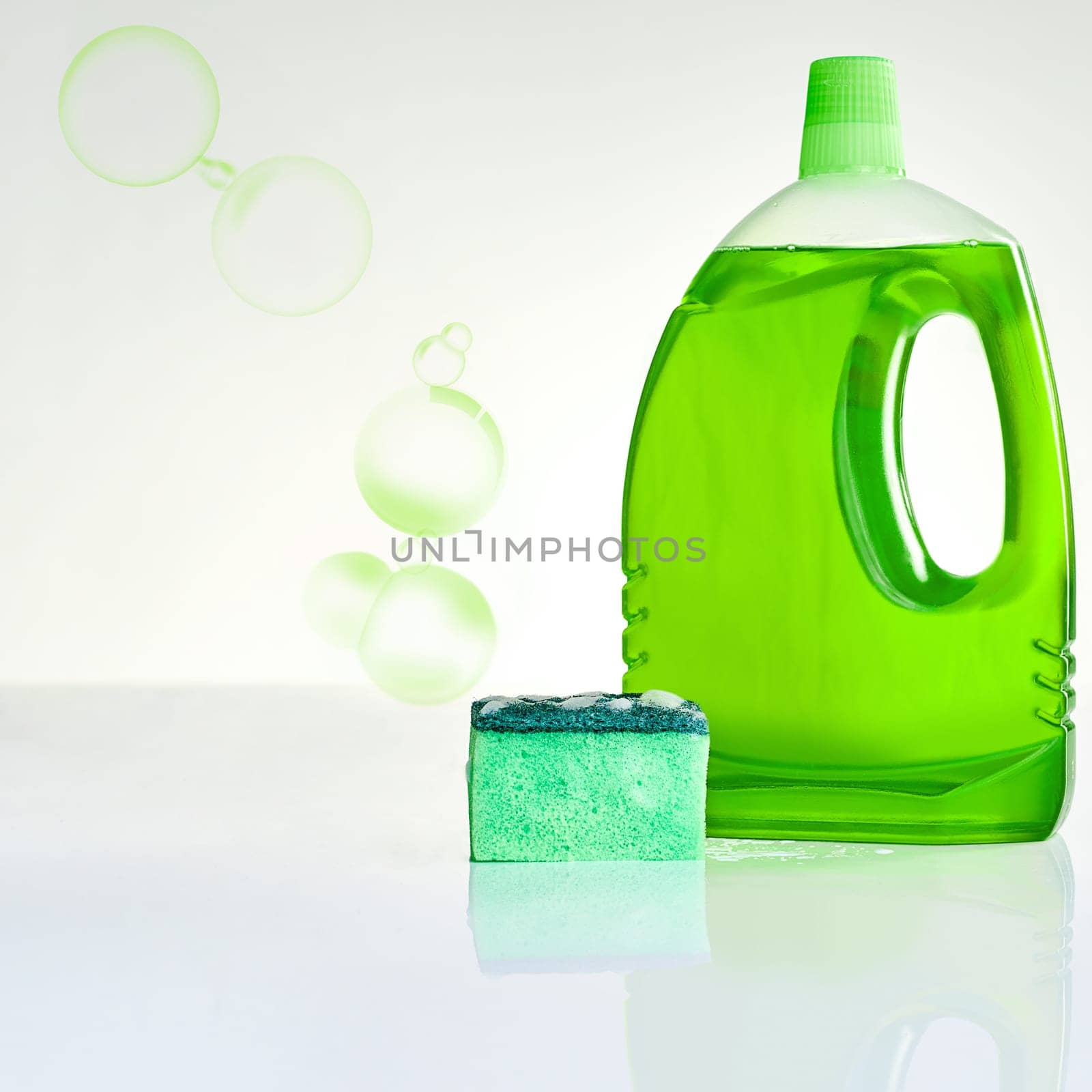 Bubble, soap and bottle with sponge for cleaning germs, dirt or bacteria in home with product placement. Housekeeping, eco friendly detergent or foam on white background for washing dishes on mockup.