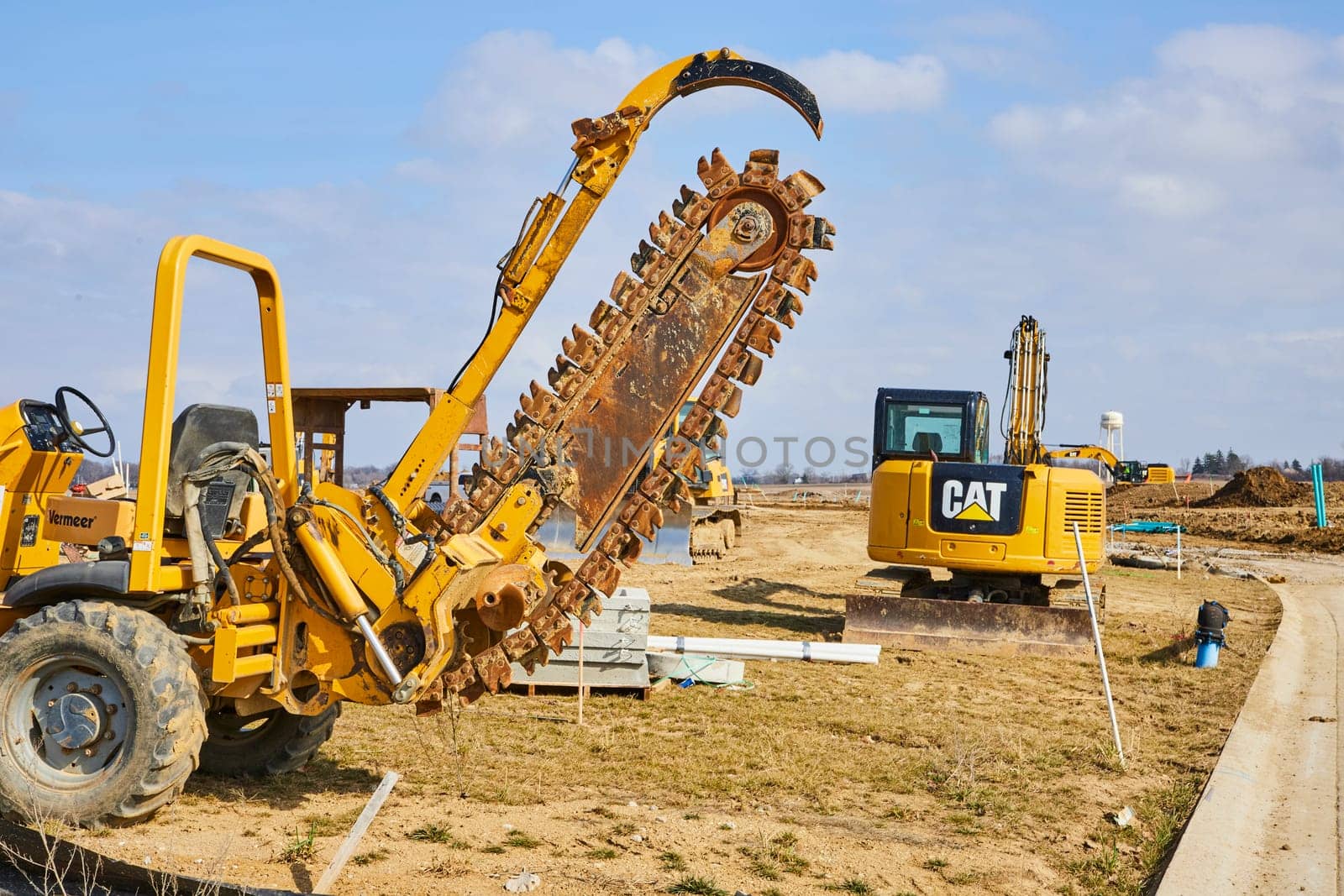 Busy Construction Site in Fort Wayne, Indiana: Power of Progress with Heavy-duty Machinery Building New Homes
