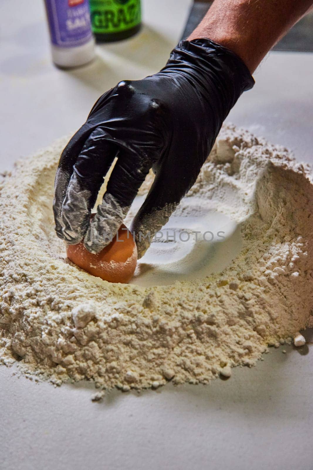 Professional hands preparing fresh homemade pasta in Fort Wayne, Indiana, capturing the art of culinary creation