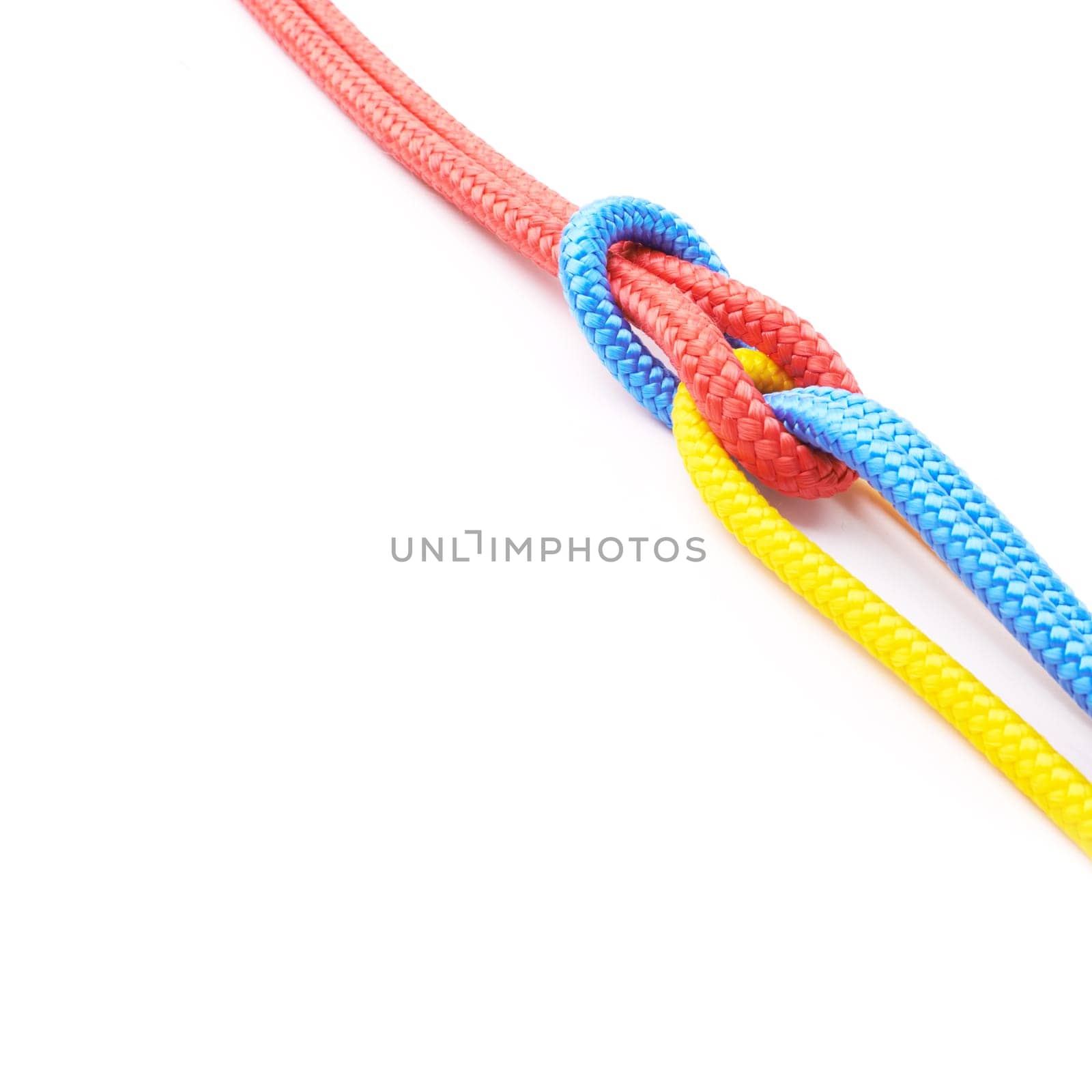Colorful, ropes and knot for pride together in studio in mockup space for unity, connect and trust. Secure, string and reef for security to stop movement of objects on isolated white background by YuriArcurs