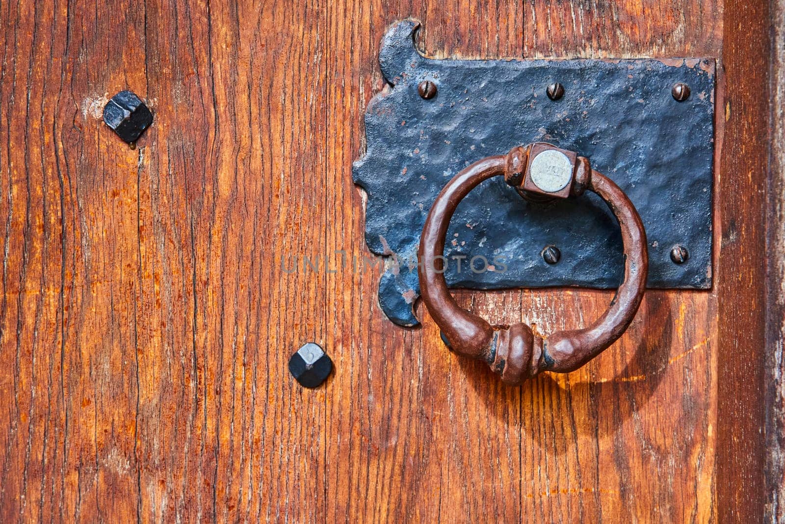 Vintage Iron Door Knocker on Rustic Wood at a Historic Indiana Seminary, Symbol of Heritage and Privacy