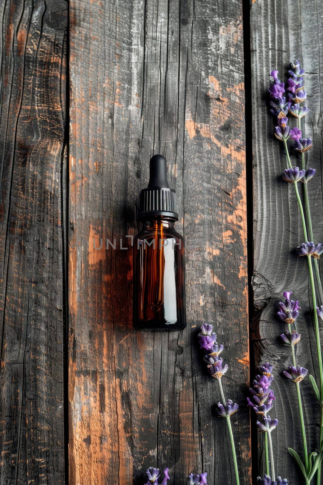 lavender essential oil in a bottle. selective focus. by yanadjana
