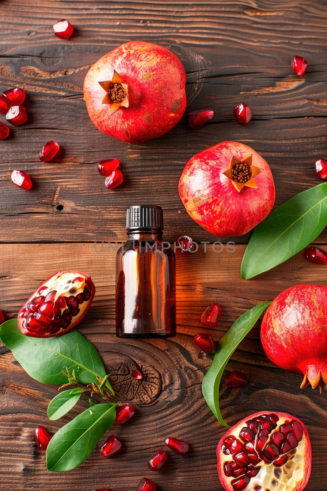 pomegranate essential oil in a bottle. selective focus. by yanadjana