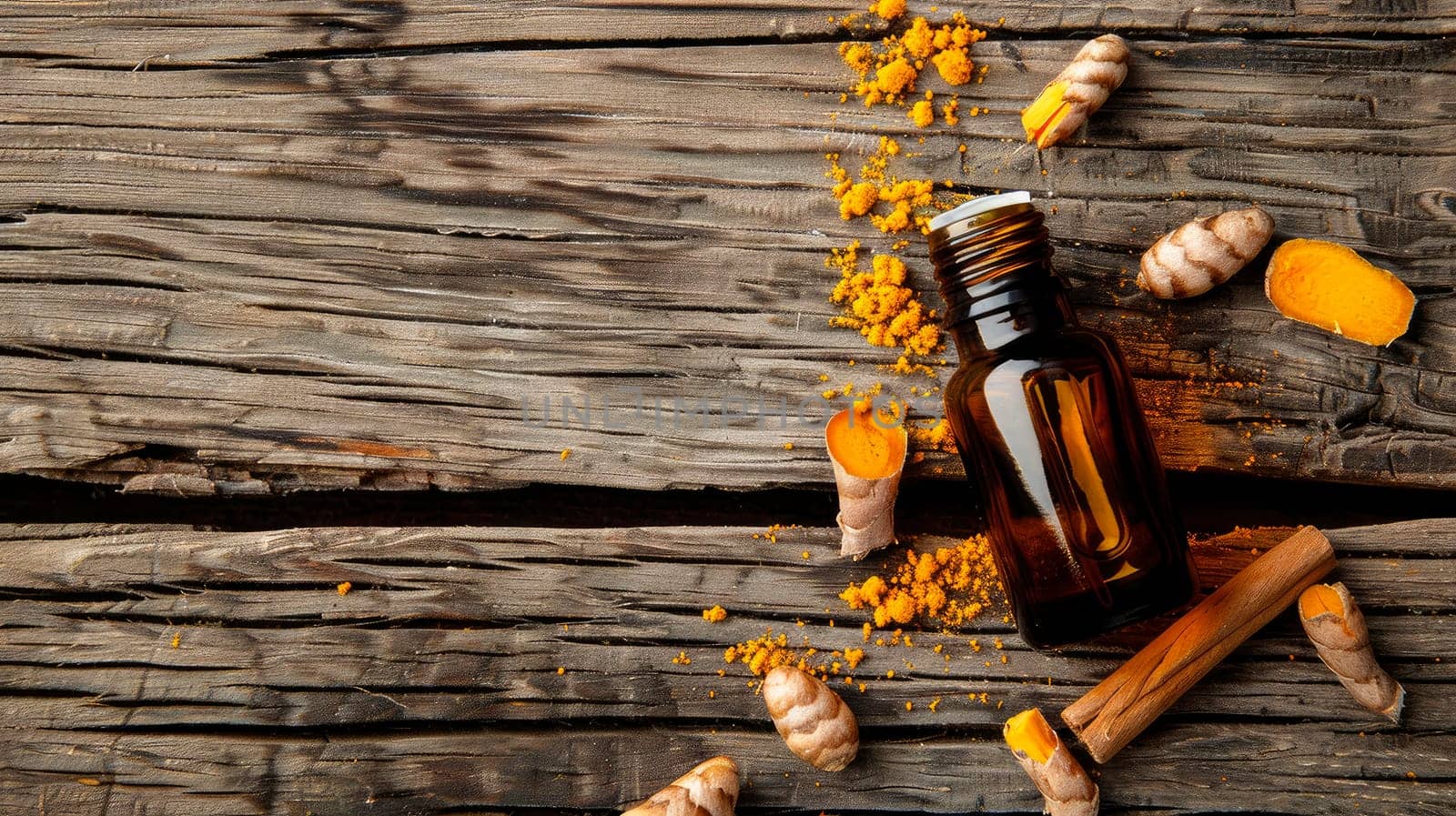 turmeric essential oil in a bottle. selective focus. by yanadjana