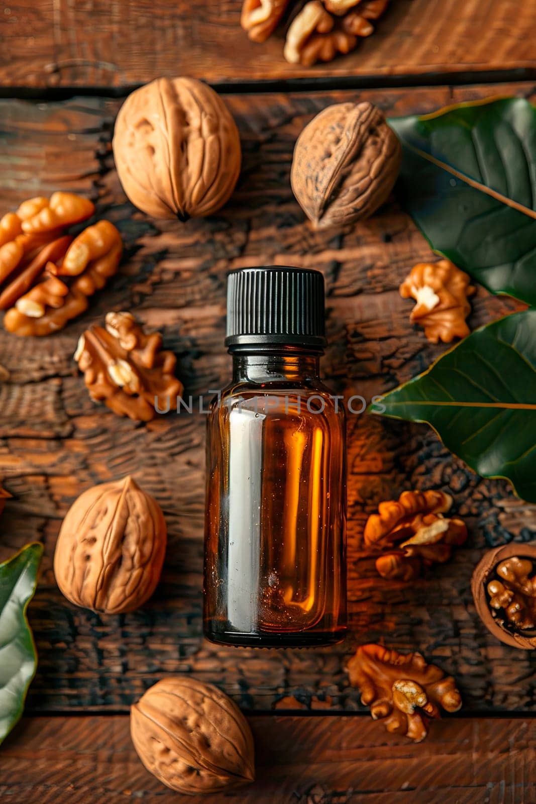 walnut essential oil in a bottle. selective focus. by yanadjana