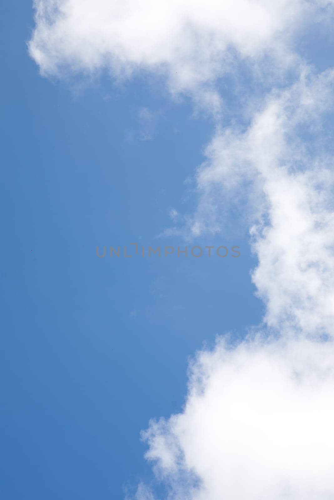 white clouds on the background of the blue sky. High quality photo