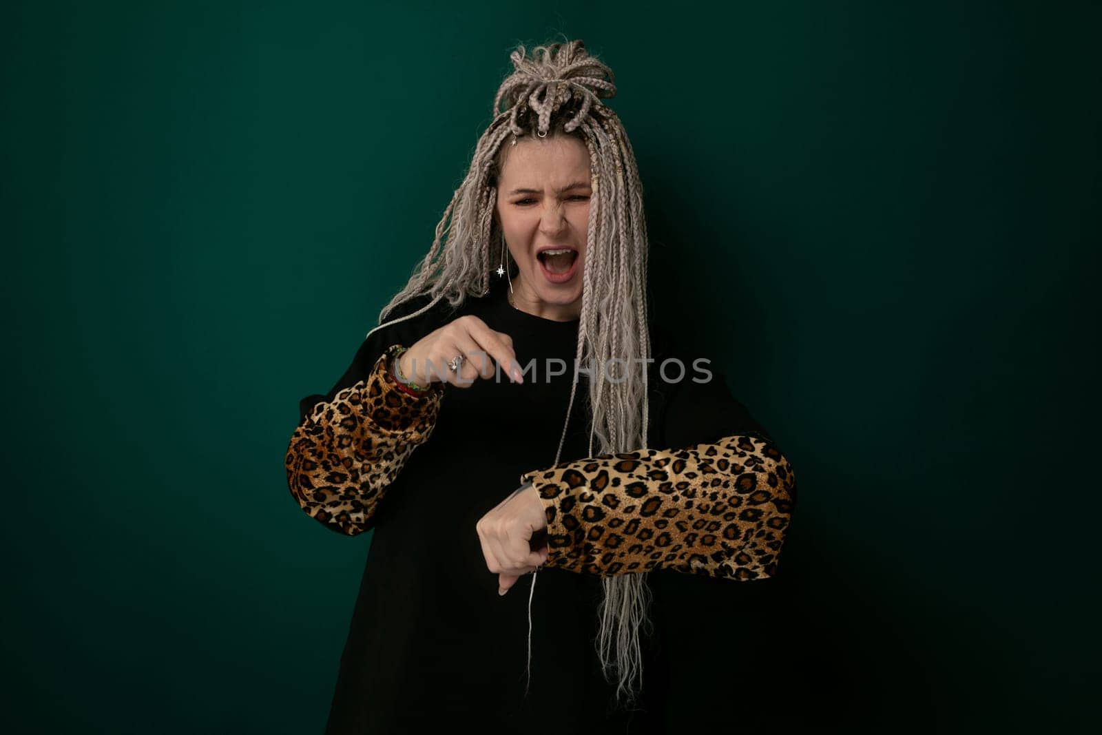 A woman with long flowing hair wearing a leopard print glove, showcasing a striking contrast between her natural beauty and the wild animal-inspired accessory. The womans graceful pose accentuates the elegance and fierceness of the leopard print glove.
