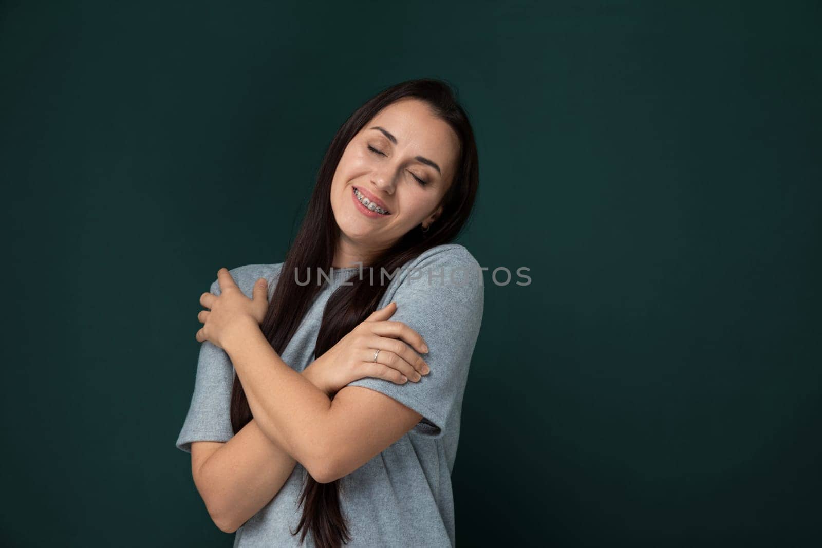 Smiling Woman With Crossed Arms by TRMK