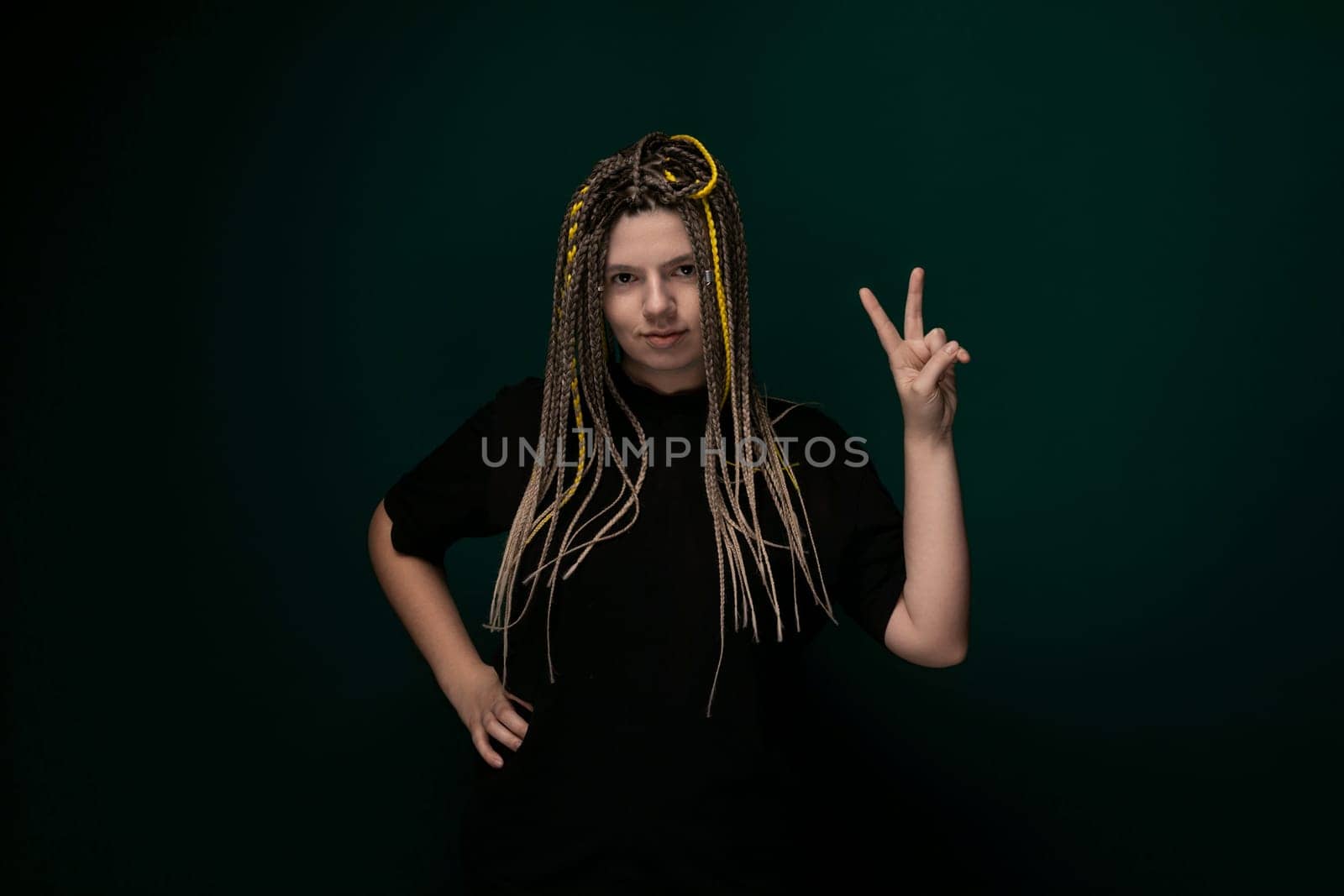 Woman With Dreadlocks Making a Peace Sign by TRMK