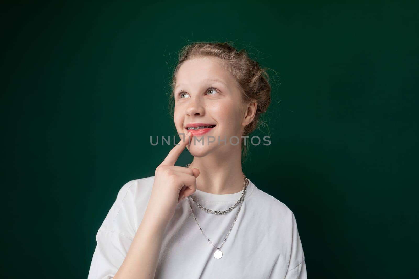 Woman Posing for Picture With Finger on Lips by TRMK
