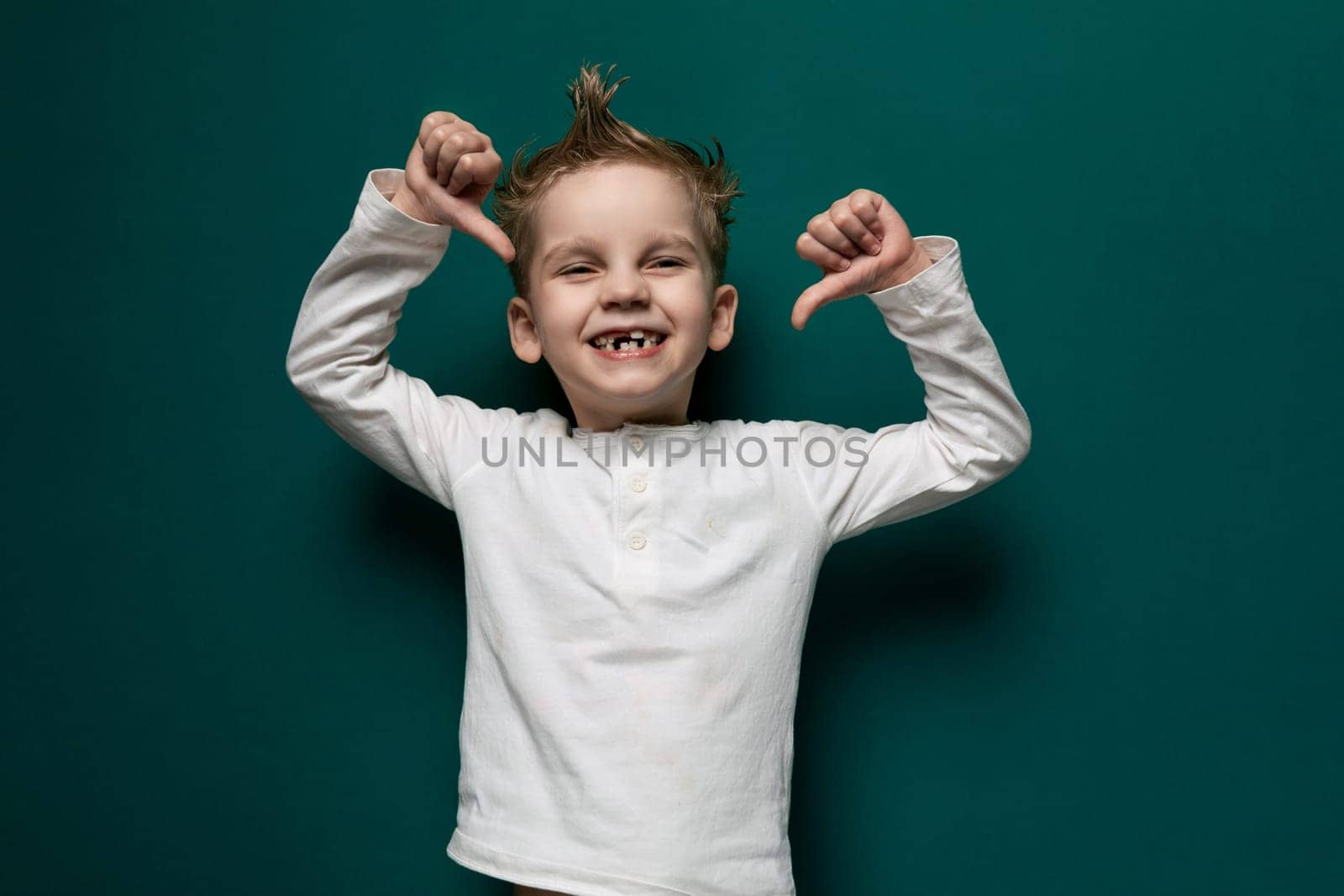 Young Boy Raising Hands in Air by TRMK
