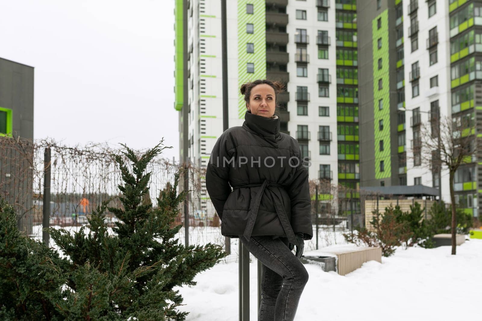 Lifestyle concept, young woman walking down the street in frosty weather.