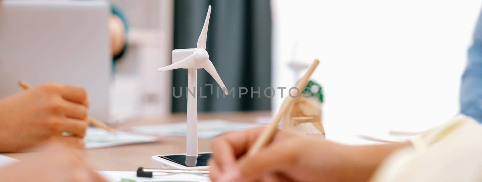 Green business meeting represented renewable energy. Closeup. Delineation. by biancoblue