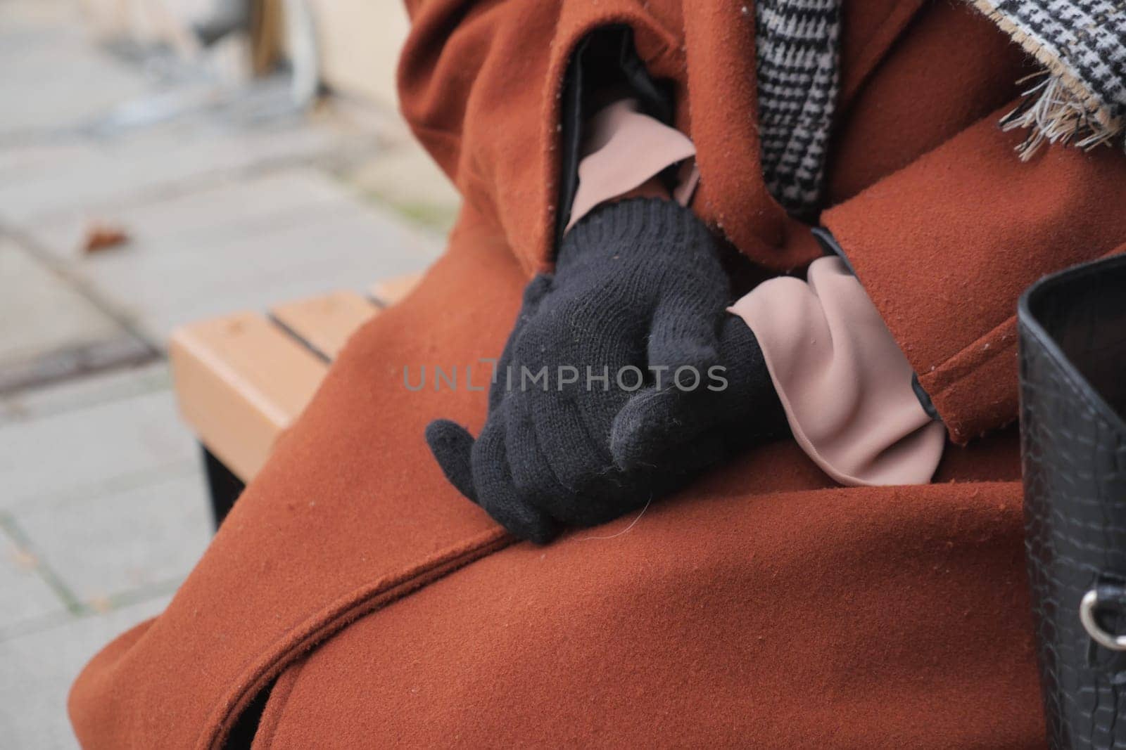 woman hands put on warm gloves on a winter cold day, by towfiq007