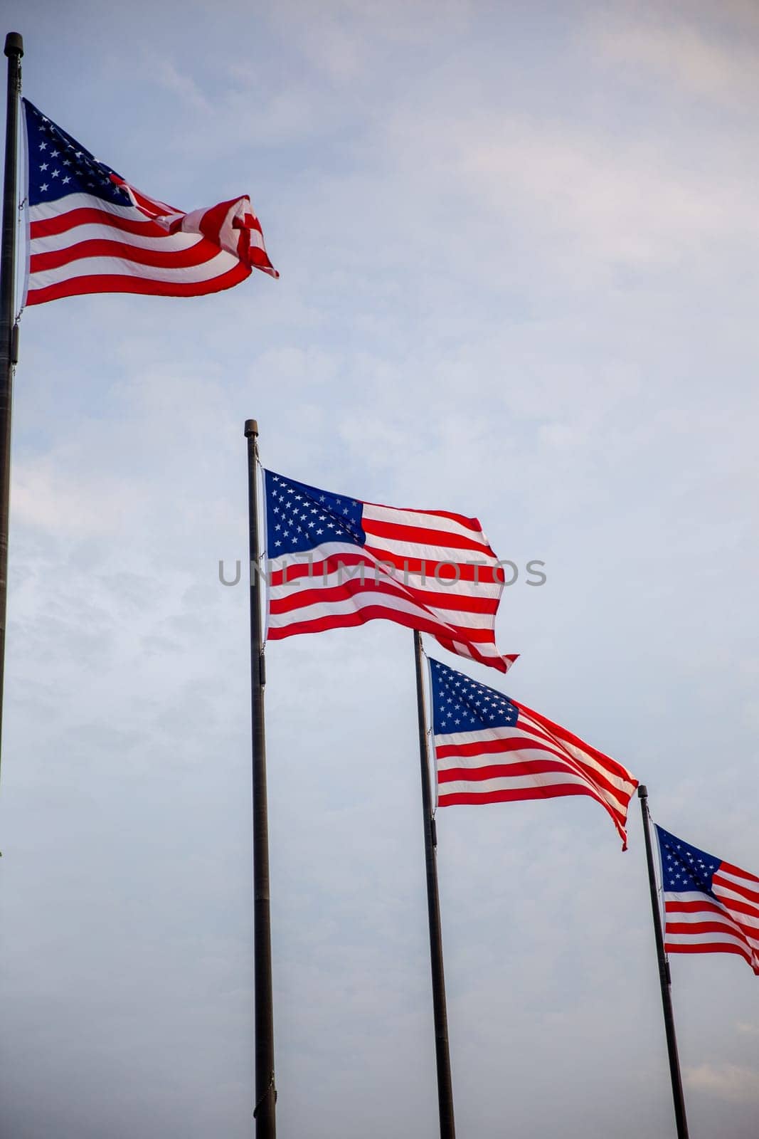 Four US Flags moving in the wind