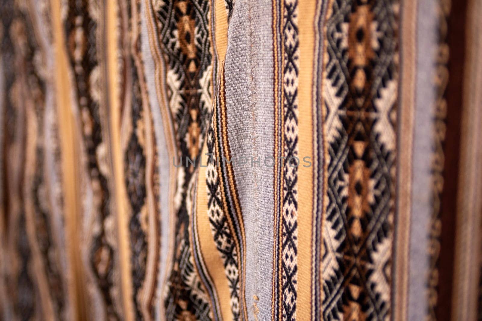 Brown, tan and black textile carpet
