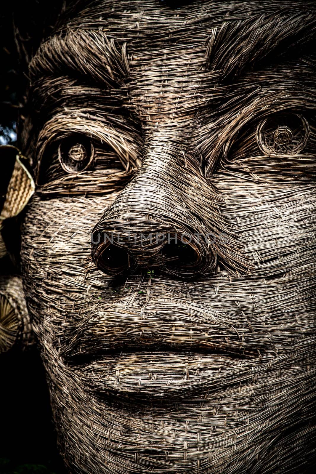 Wicker balinese face at a resort shot close up