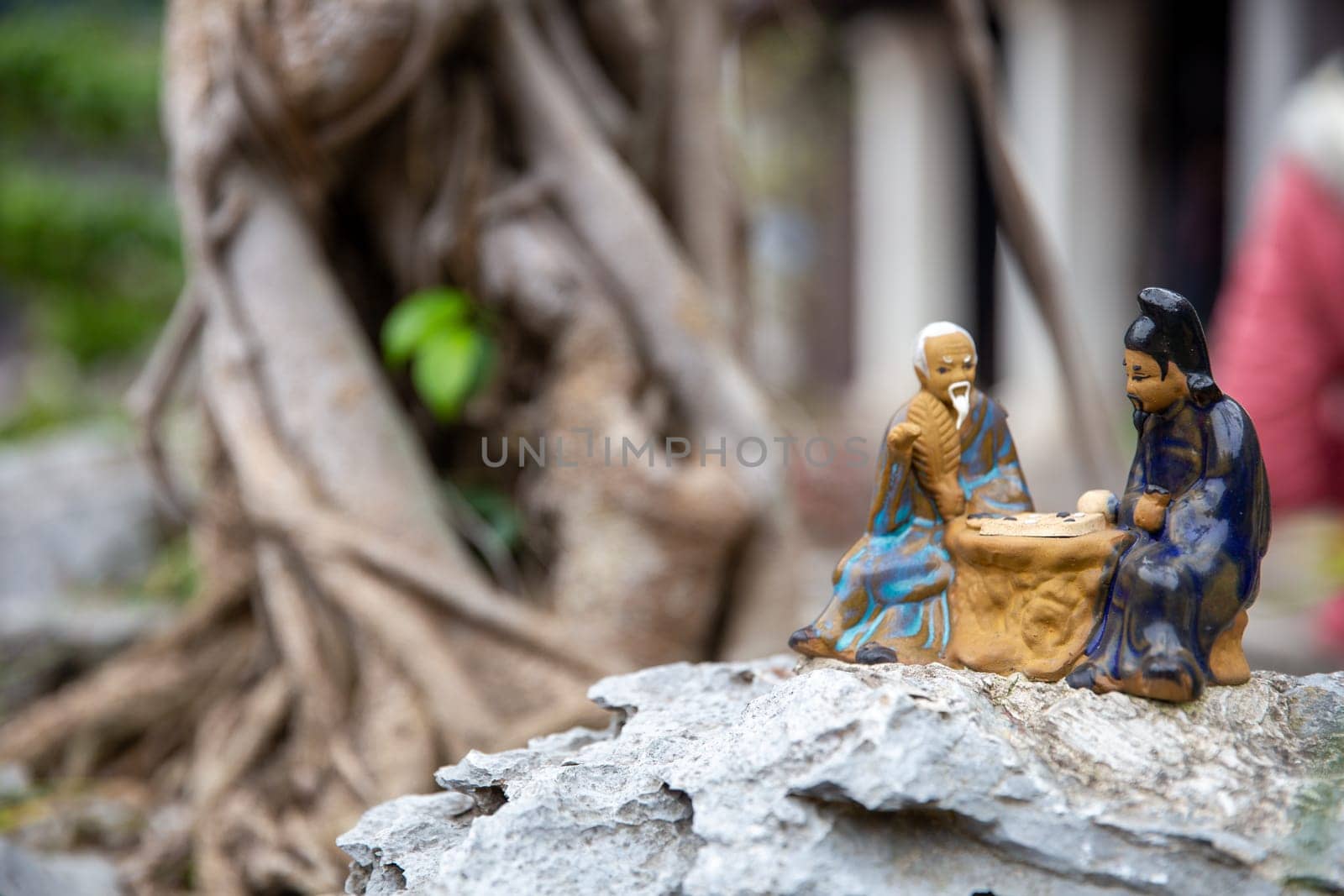 Vietnamese Figurines playing a game with copy space