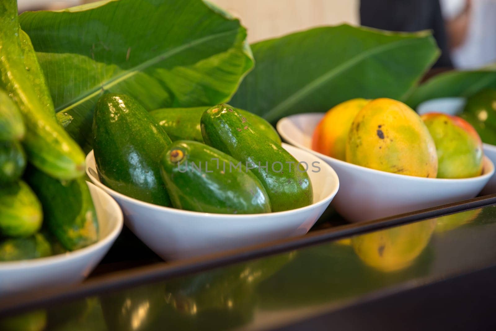 Fresh Mangos, avocados and cucumbers on display