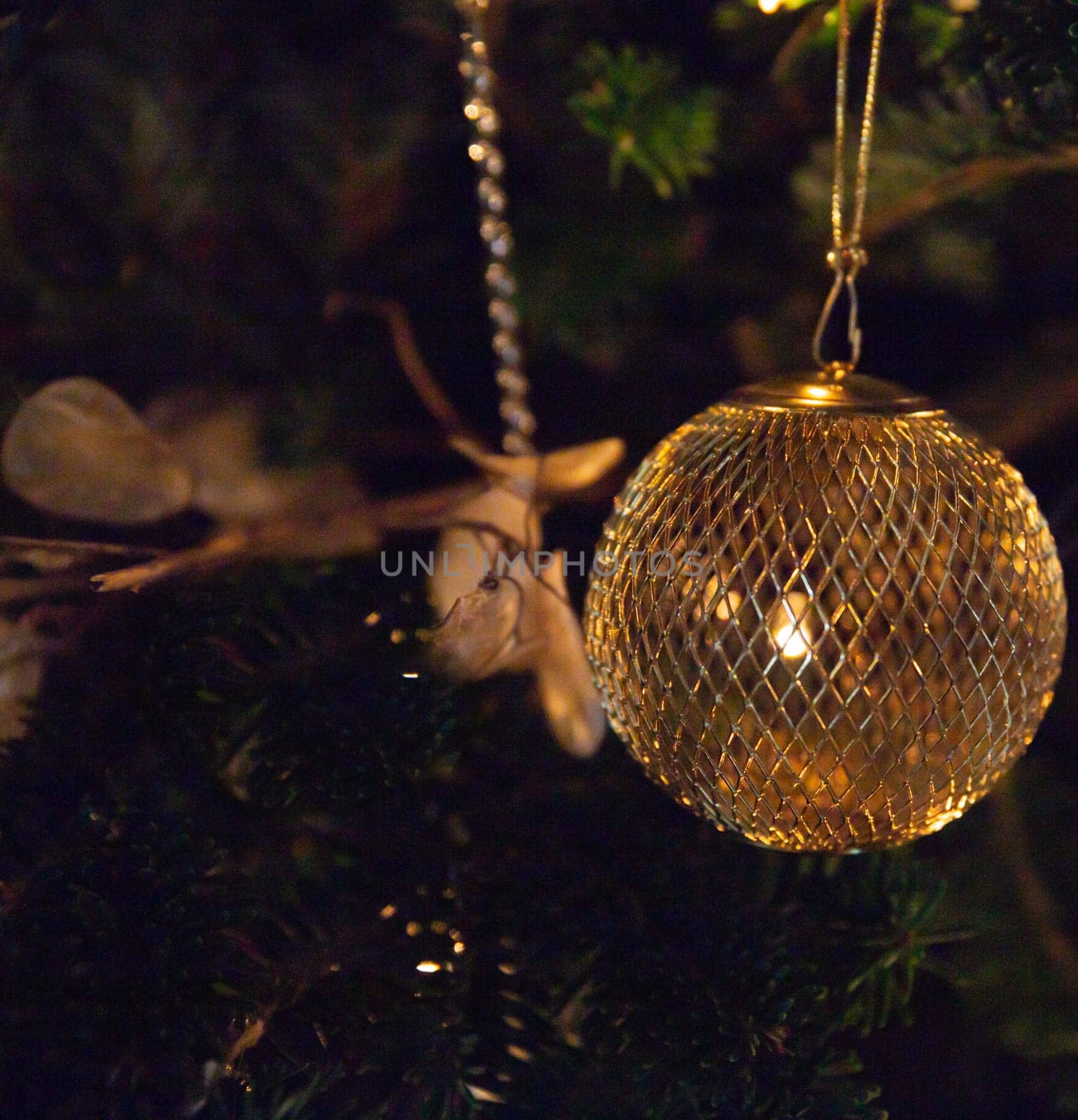 Golden Hanging Christmas Ornament on a tree