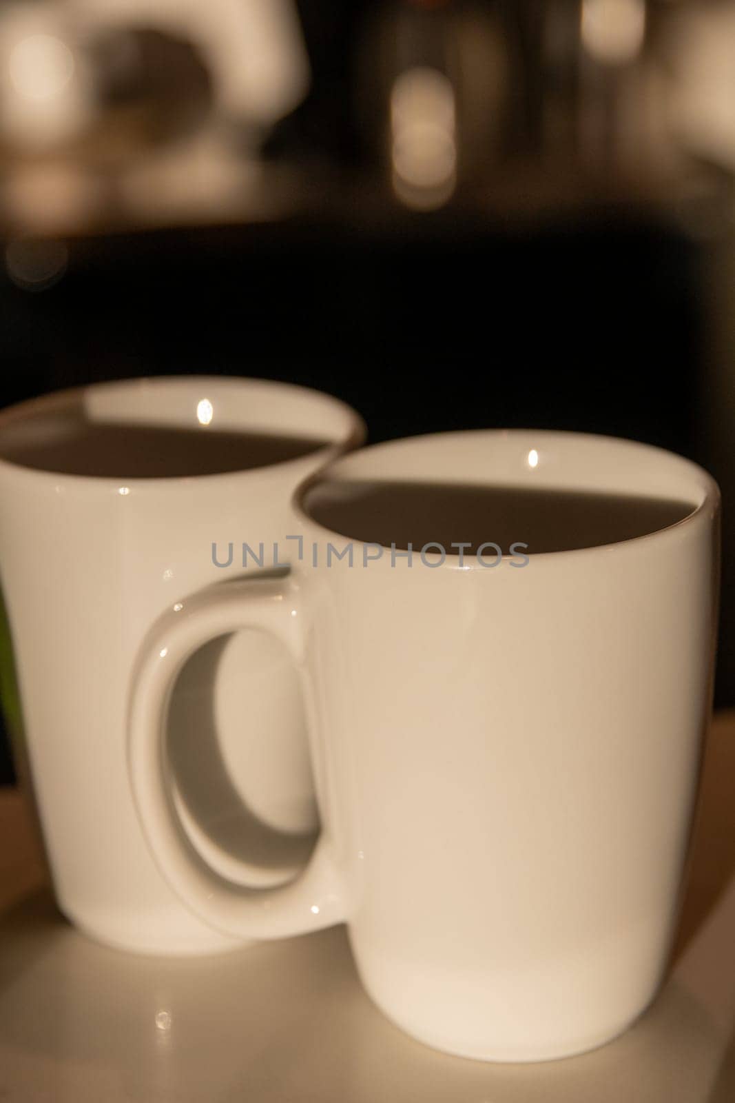 Coffee or tea mugs on a bar top