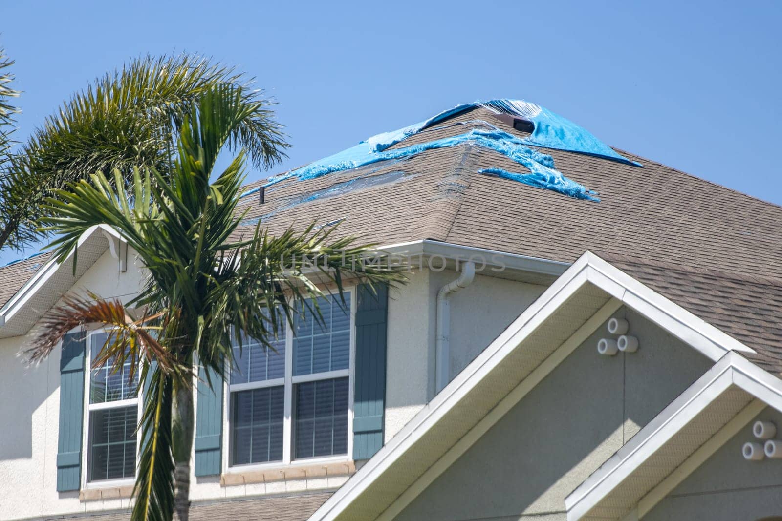 Destroyed Tarp on the roof waiting to get repaired