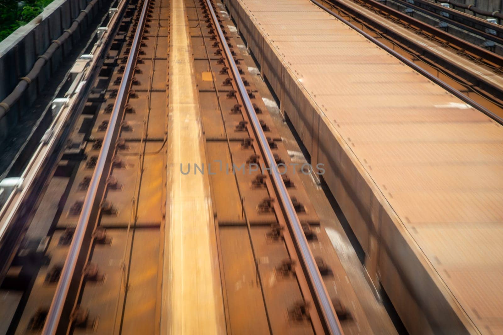 Light rail tracks shot from speeding train