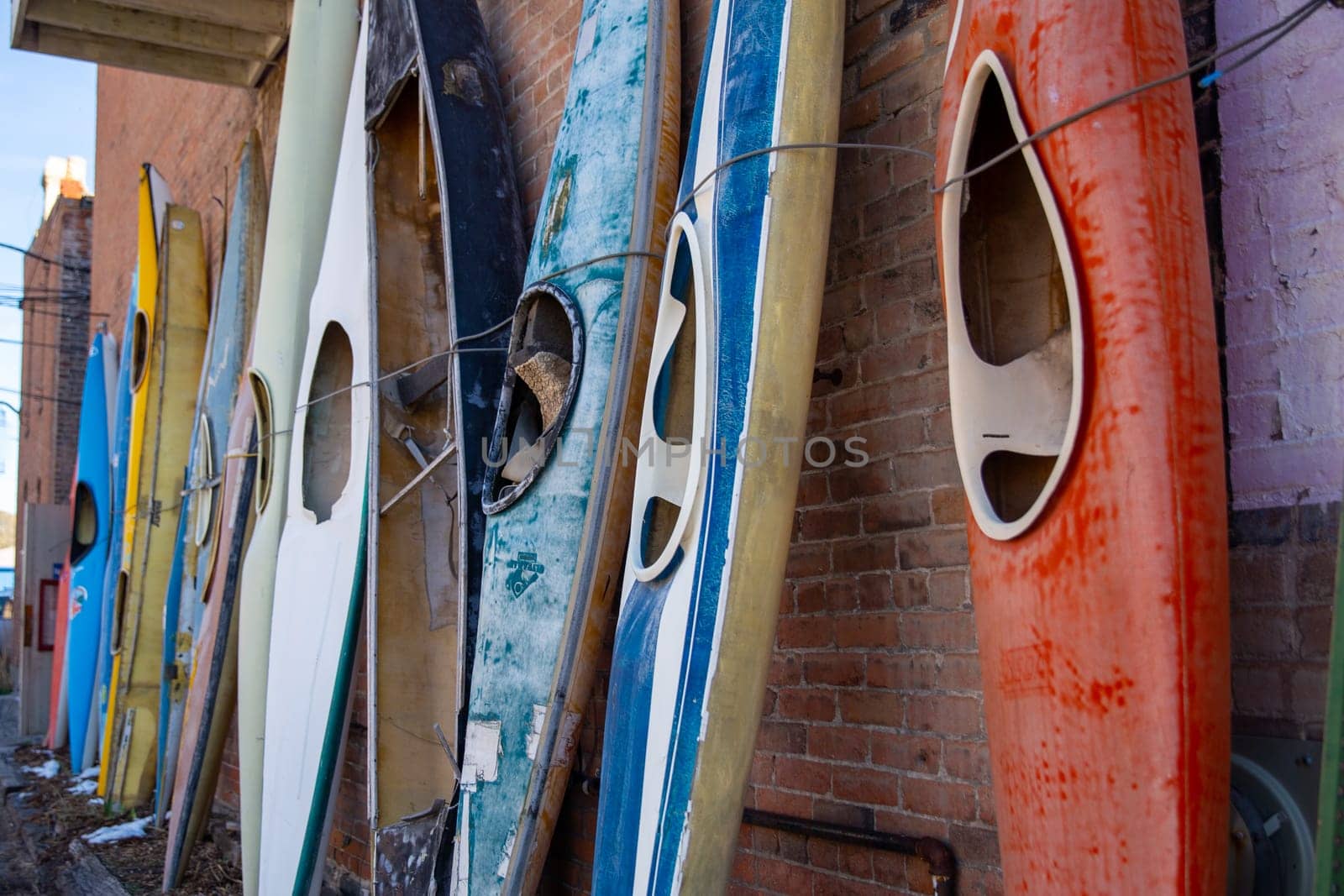 Canoes tied up in a row shot vertical