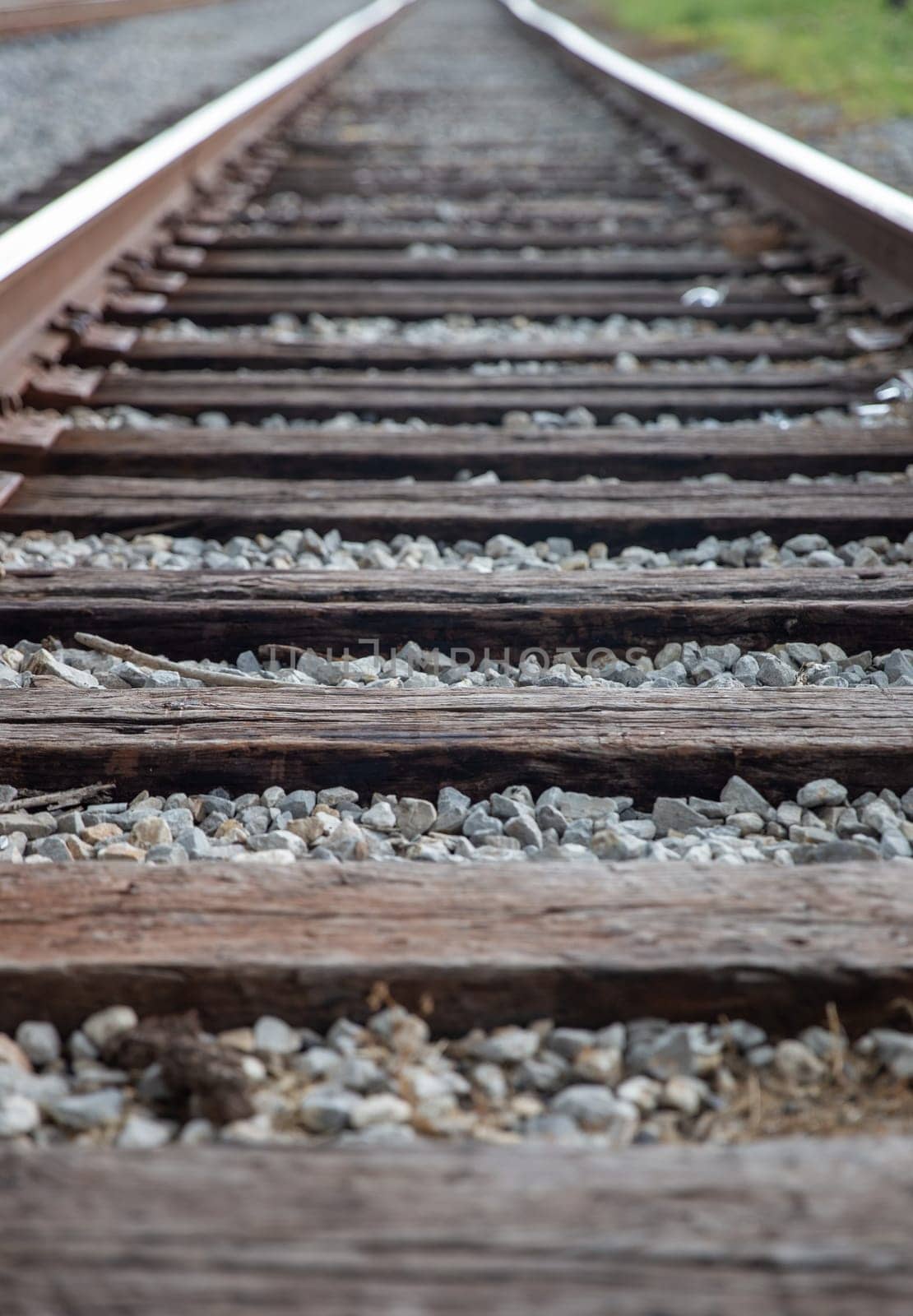 Rail Road tracks into the horizon as a path